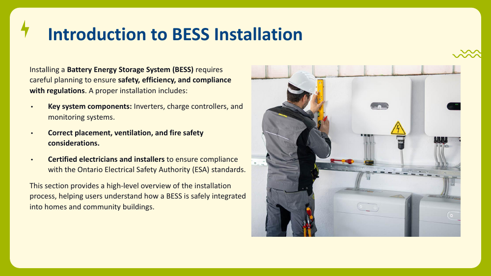Technician in a hard hat and gloves working on wall-mounted electrical equipment beside a battery enclosure marked with a warning triangle.